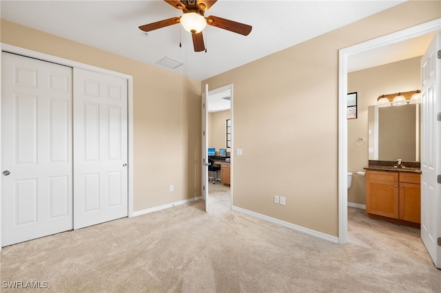 11999 Palba Way Unit 6405, Fort Myers, FL 33912 - unfurnished bedroom featuring light colored carpet, a closet, ensuite bathroom, and ceiling fan