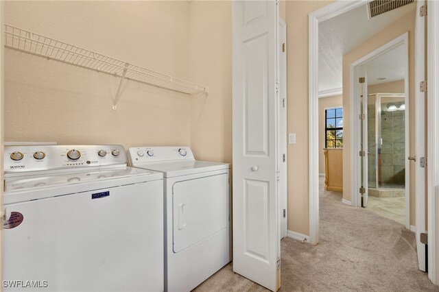 11999 Palba Way Unit 6405, Fort Myers, FL 33912 - laundry area featuring washer and dryer and light carpet