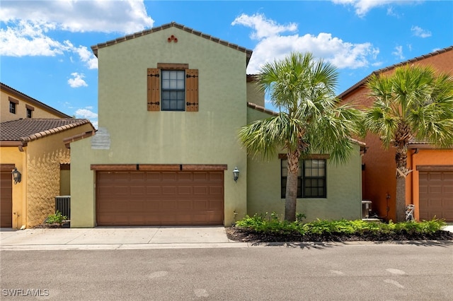 11999 Palba Way Unit 6405, Fort Myers, FL 33912 - mediterranean / spanish house with stucco siding, concrete driveway, and a garage