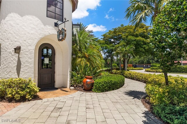 11999 Palba Way Unit 6405, Fort Myers, FL 33912 - view of exterior entry featuring stucco siding