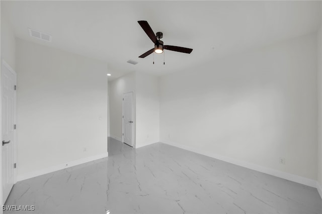 2511 23rd St W, Lehigh Acres, FL 33971 - empty room featuring marble finish floors and a ceiling fan