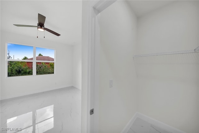 2511 23rd St W, Lehigh Acres, FL 33971 - spacious closet featuring marble look tile flooring and a ceiling fan