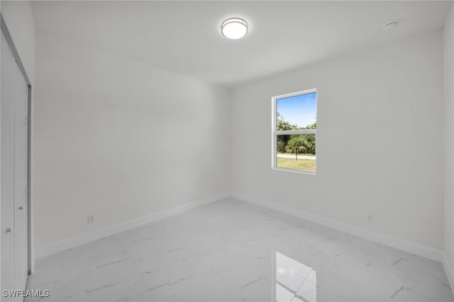2511 23rd St W, Lehigh Acres, FL 33971 - empty room featuring marble finish floors