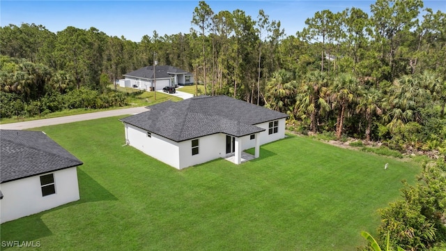 2511 23rd St W, Lehigh Acres, FL 33971 - view from above of property featuring a forest