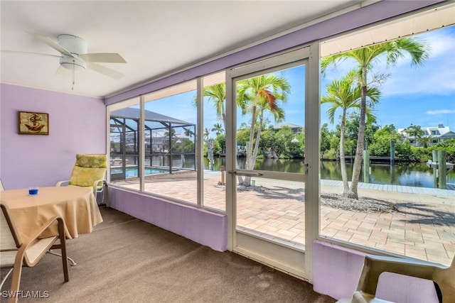 5251-5253 Serenity Cv, Bokeelia, FL 33922 - sunroom with a water view and ceiling fan
