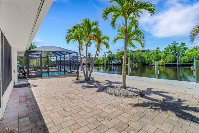 5251-5253 Serenity Cv, Bokeelia, FL 33922 - swimming pool featuring a patio area, a lanai, and a water view