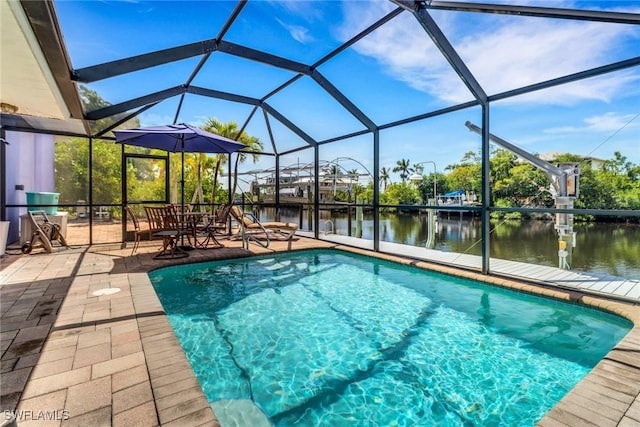5251-5253 Serenity Cv, Bokeelia, FL 33922 - outdoor pool featuring a water view, a patio area, and a lanai