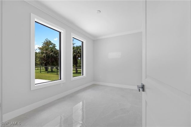 4325 47th Ave NE, Naples, FL 34120 - spare room with healthy amount of natural light, ornamental molding, and light marble finish flooring