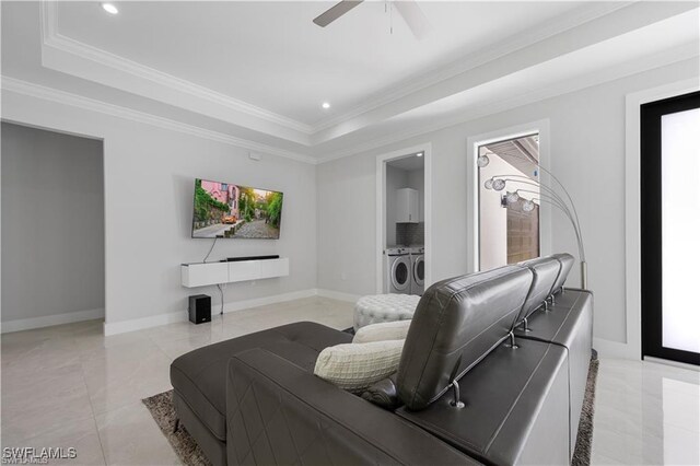 4325 47th Ave NE, Naples, FL 34120 - living area with separate washer and dryer, a raised ceiling, ceiling fan, ornamental molding, and recessed lighting