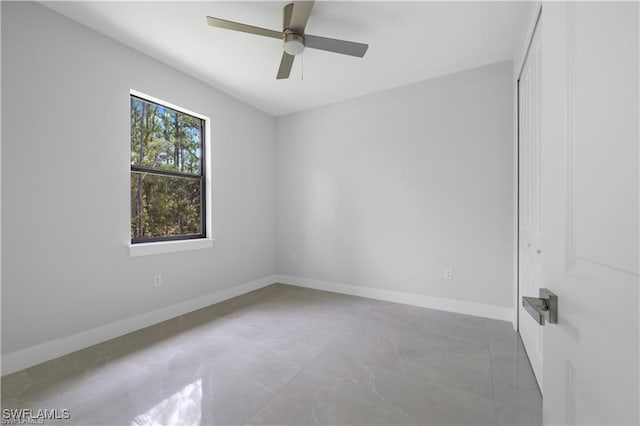 4325 47th Ave NE, Naples, FL 34120 - unfurnished room with a ceiling fan and baseboards