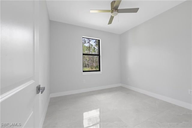 4325 47th Ave NE, Naples, FL 34120 - spare room featuring light marble finish flooring and a ceiling fan