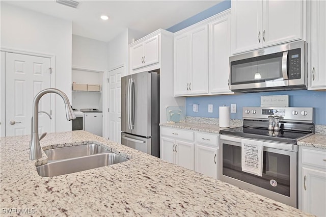 4209 Bloomfield St, Fort Myers, FL 33916 - kitchen with stainless steel appliances, white cabinetry, light stone countertops, and recessed lighting