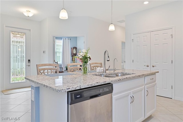 4209 Bloomfield St, Fort Myers, FL 33916 - kitchen featuring stainless steel dishwasher, light tile patterned floors, plenty of natural light, and an island with sink