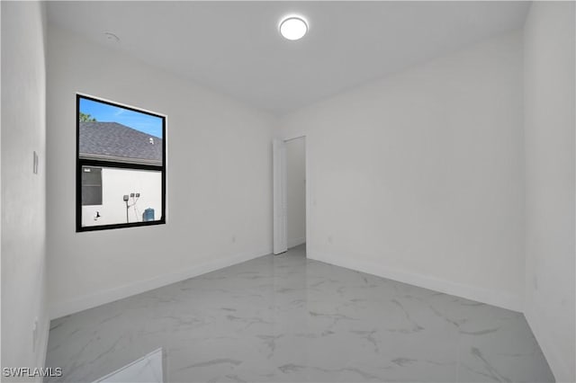 3513 36th St SW, Lehigh Acres, FL 33976 - empty room featuring marble finish floors