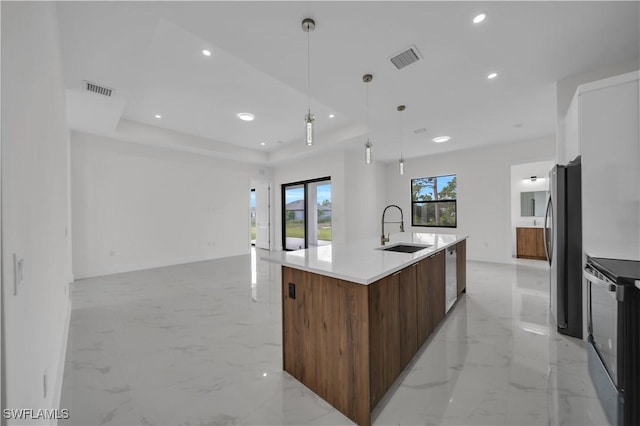 3513 36th St SW, Lehigh Acres, FL 33976 - kitchen featuring modern cabinets, appliances with stainless steel finishes, open floor plan, light marble finish floors, and recessed lighting