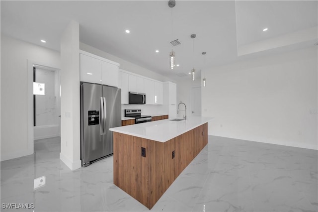 3513 36th St SW, Lehigh Acres, FL 33976 - kitchen featuring appliances with stainless steel finishes, light marble finish floors, modern cabinets, white cabinets, and recessed lighting