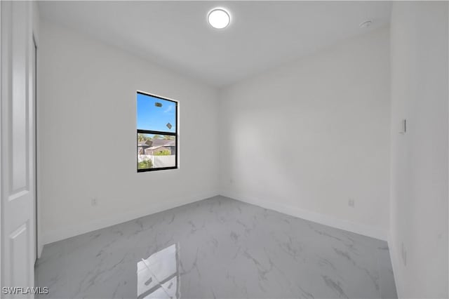3513 36th St SW, Lehigh Acres, FL 33976 - unfurnished room with marble finish floors and baseboards