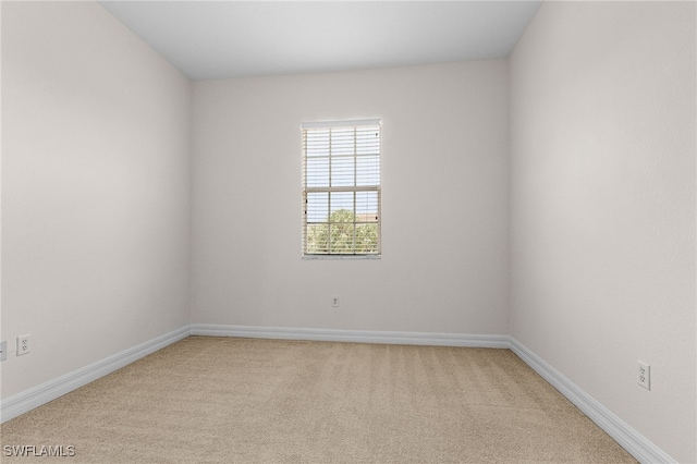 16142 Via Solera Cir Unit 103, Fort Myers, FL 33908 - spare room featuring light carpet and baseboards