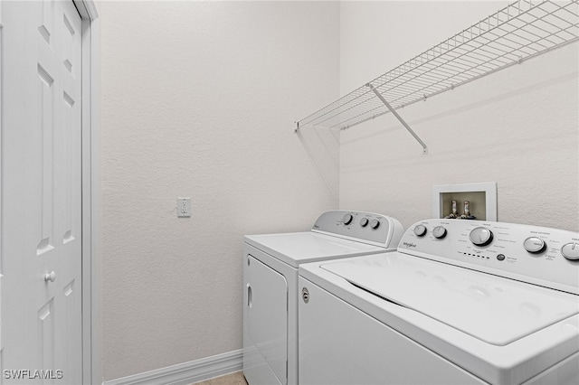 16142 Via Solera Cir Unit 103, Fort Myers, FL 33908 - laundry area with washer and clothes dryer and a textured wall