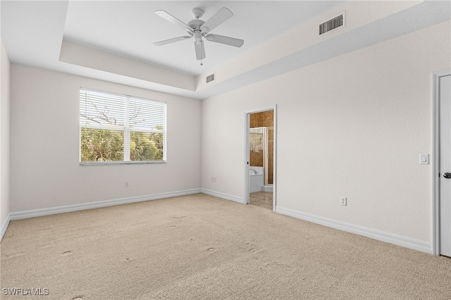 16142 Via Solera Cir Unit 103, Fort Myers, FL 33908 - spare room with light colored carpet, ceiling fan, and a raised ceiling