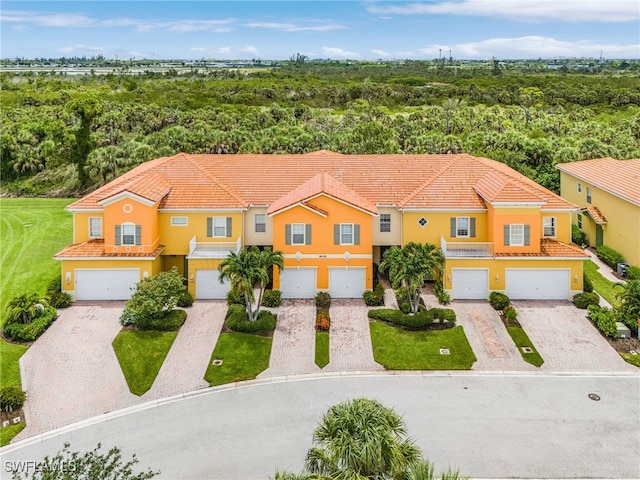 16142 Via Solera Cir Unit 103, Fort Myers, FL 33908 - view of front of property with stucco siding, driveway, and a tile roof