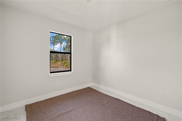 3587 18th Ave SE, Naples, FL 34117 - spare room with baseboards
