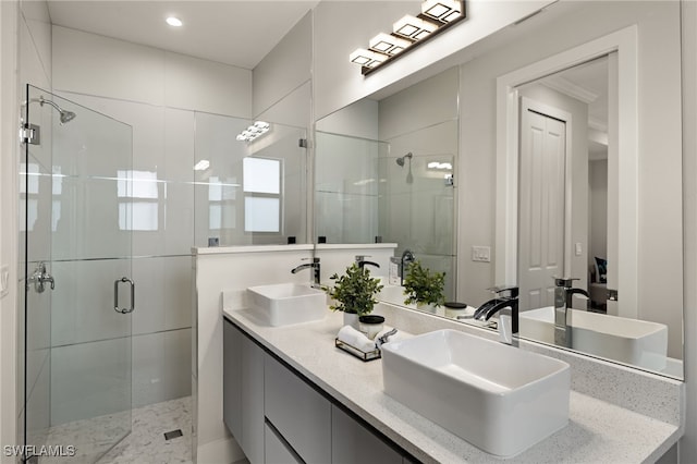 3587 18th Ave SE, Naples, FL 34117 - bathroom with a shower stall, double vanity, and recessed lighting