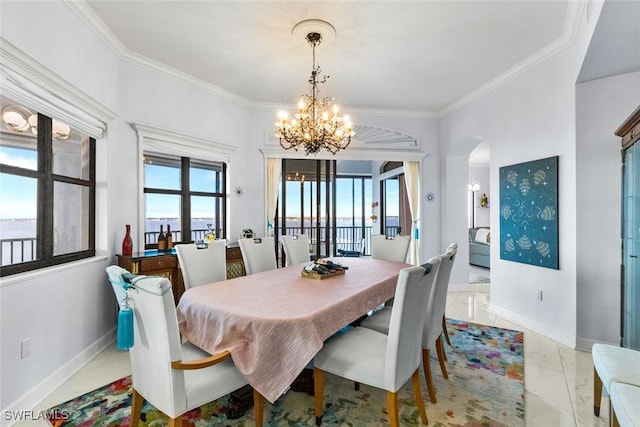 11640 Court Of Palms Unit 602, Fort Myers, FL 33908 - dining area with a chandelier, light marble finish flooring, arched walkways, and ornamental molding