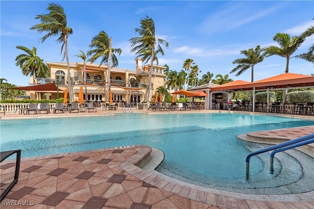 11640 Court Of Palms Unit 602, Fort Myers, FL 33908 - community pool featuring a patio