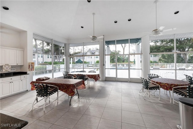 2852 Aintree Ln Unit K201, Naples, FL 34112 - dining area featuring a ceiling fan, high vaulted ceiling, light tile patterned floors, and healthy amount of natural light