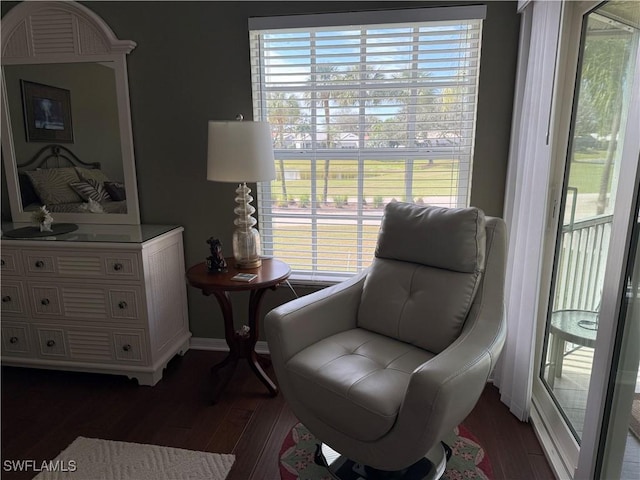 13611 Worthington Way Unit 1307, Bonita Springs, FL 34135 - sitting room with dark wood-style flooring and healthy amount of natural light