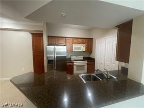 12936 Violino Ln Unit 203, Naples, FL 34105 - photo 3