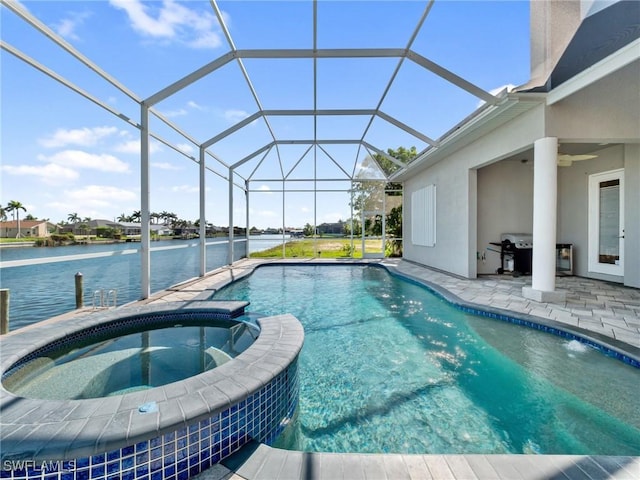 2705 SW 30th Ter, Cape Coral, FL 33914 - view of pool with a patio, a pool with connected hot tub, ceiling fan, a water view, and a lanai