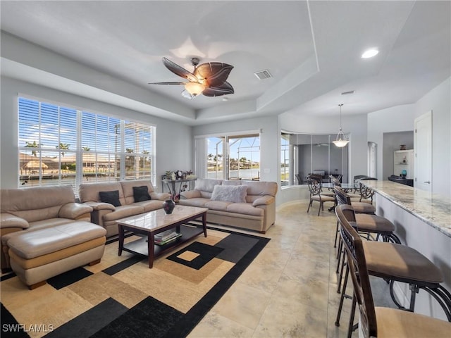 2705 SW 30th Ter, Cape Coral, FL 33914 - living room with ceiling fan, a raised ceiling, and recessed lighting