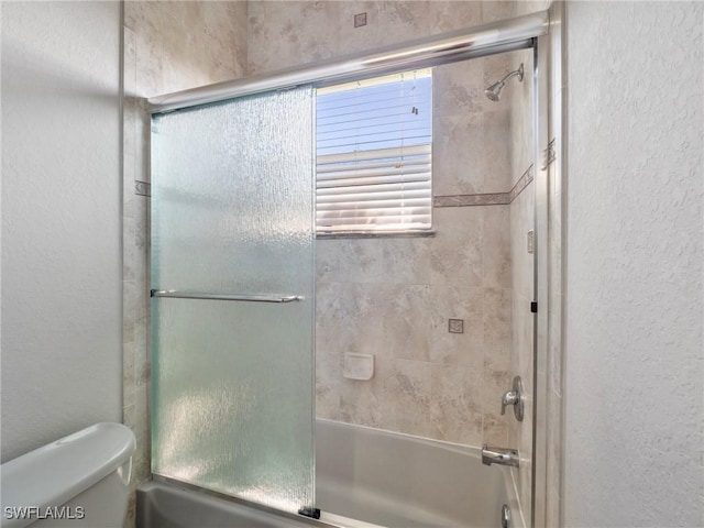 2705 SW 30th Ter, Cape Coral, FL 33914 - full bath featuring a textured wall and bath / shower combo with glass door