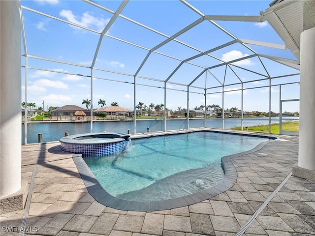 2705 SW 30th Ter, Cape Coral, FL 33914 - view of swimming pool with a pool with connected hot tub, a patio, a water view, and a lanai