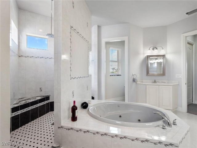 2705 SW 30th Ter, Cape Coral, FL 33914 - full bath featuring a tub with jets, walk in shower, and vanity