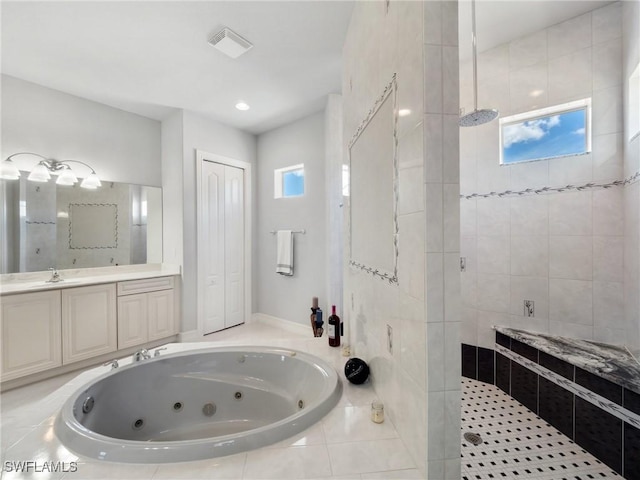 2705 SW 30th Ter, Cape Coral, FL 33914 - bathroom with a walk in shower, a tub with jets, vanity, and radiator heating unit