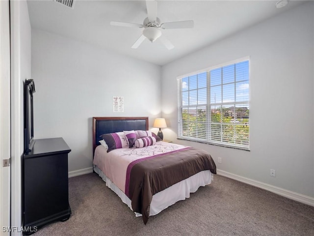 2705 SW 30th Ter, Cape Coral, FL 33914 - carpeted bedroom with baseboards and a ceiling fan