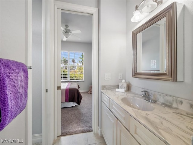 2705 SW 30th Ter, Cape Coral, FL 33914 - bathroom with vanity, ensuite bath, a ceiling fan, and tile patterned floors