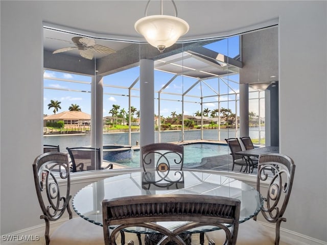 2705 SW 30th Ter, Cape Coral, FL 33914 - sunroom featuring ceiling fan, a pool, a water view, and plenty of natural light