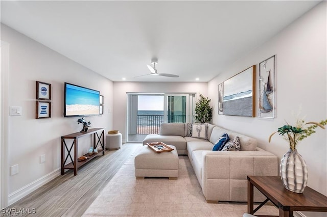 26000 Hickory Blvd Unit 205, Bonita Springs, FL 34134 - living area with light wood-type flooring and a ceiling fan