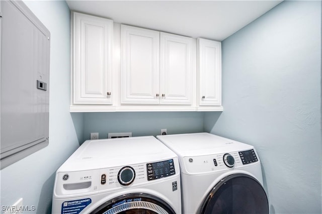26000 Hickory Blvd Unit 205, Bonita Springs, FL 34134 - laundry room with cabinet space and washing machine and dryer