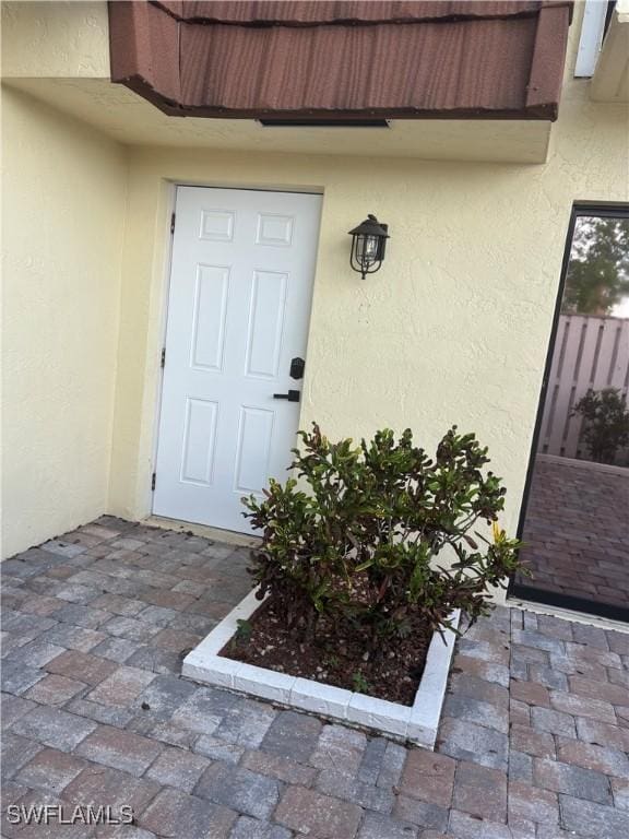 5245 Cedarbend Dr Unit 4, Fort Myers, FL 33919 - entrance to property with stucco siding