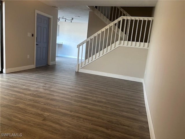 5245 Cedarbend Dr Unit 4, Fort Myers, FL 33919 - unfurnished living room featuring wood finished floors and stairway