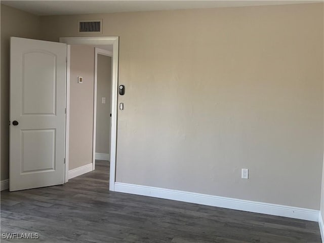 5245 Cedarbend Dr Unit 4, Fort Myers, FL 33919 - empty room featuring baseboards and dark wood-type flooring