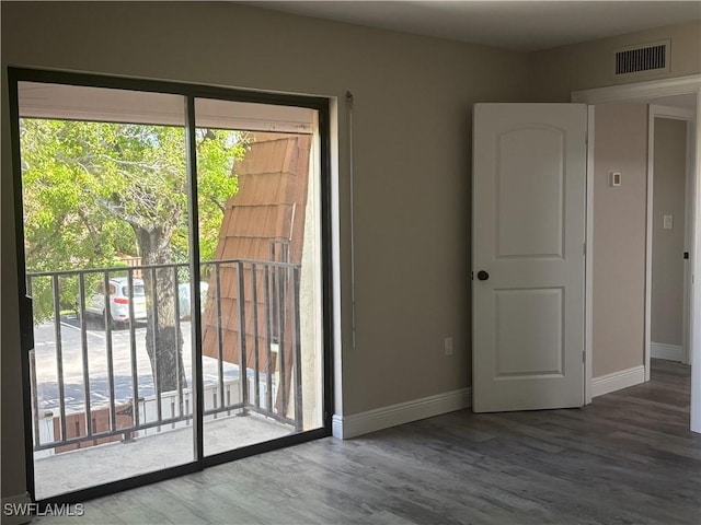 5245 Cedarbend Dr Unit 4, Fort Myers, FL 33919 - empty room featuring wood finished floors and plenty of natural light