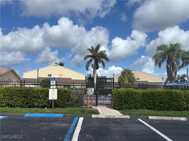 5245 Cedarbend Dr Unit 4, Fort Myers, FL 33919 - uncovered parking lot with a gate