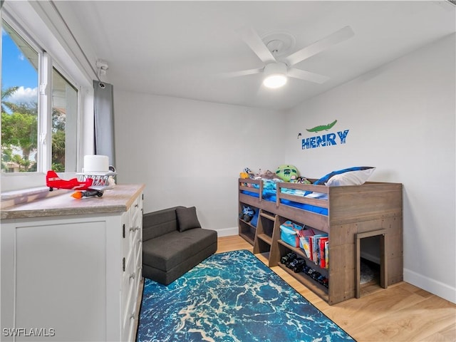 505 Monterey Ave, Cape Coral, FL 33904 - bedroom with light wood finished floors and ceiling fan