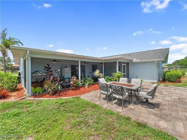 505 Monterey Ave, Cape Coral, FL 33904 - back of property featuring ceiling fan, stucco siding, a patio area, and a yard
